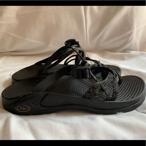 Black double strap backless chacos.